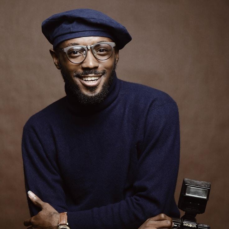 Alex Rivera, Lead Design Curator at Quill Linen Harbor, reviewing corporate floral arrangements